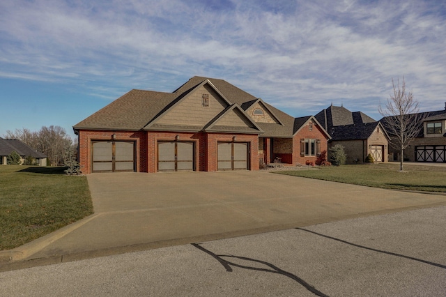 craftsman-style house featuring a garage and a front lawn