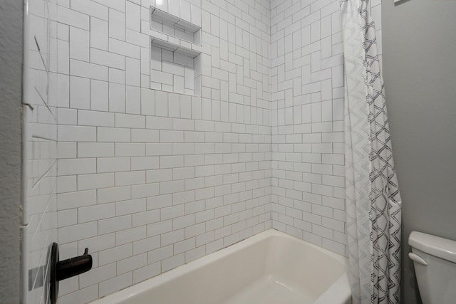 bathroom with toilet and shower / bathtub combination with curtain