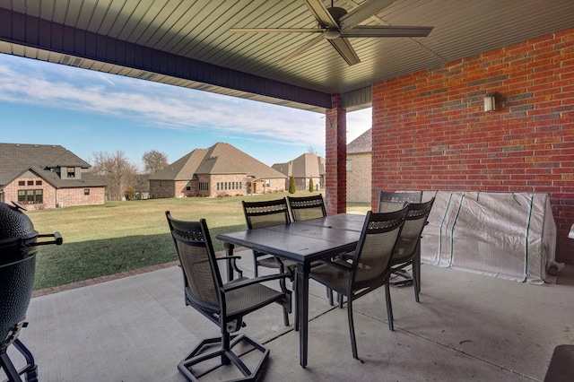 view of patio with ceiling fan and area for grilling