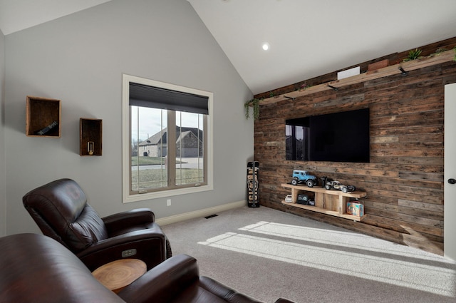 living room featuring carpet floors and lofted ceiling