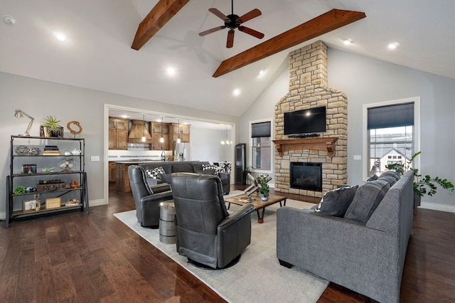 living room featuring ceiling fan, a stone fireplace, dark hardwood / wood-style floors, high vaulted ceiling, and beamed ceiling