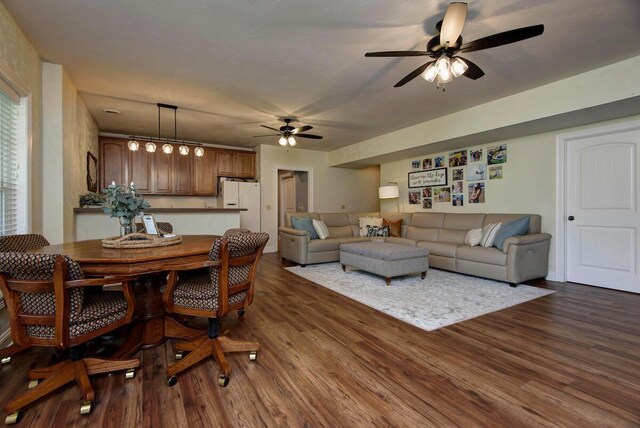 living room with ceiling fan and hardwood / wood-style floors