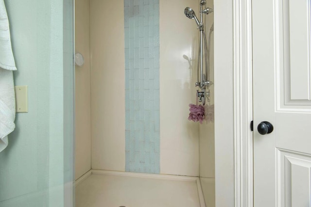 bathroom with tiled shower