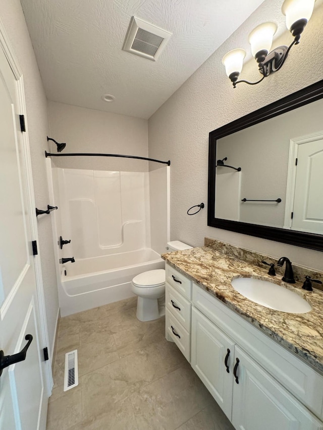 full bathroom featuring vanity, toilet, a textured ceiling, and shower / bathing tub combination