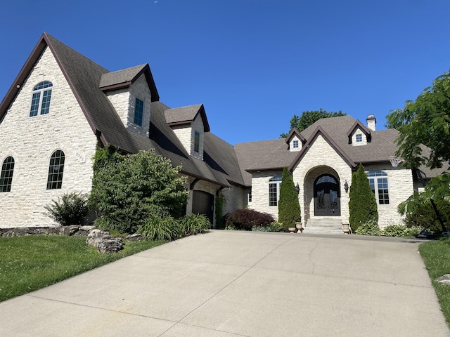 8304 Rolling Hills Dr, Nixa, MO 65714 - french country home with stone siding and roof with shingles