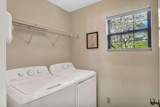 laundry room with independent washer and dryer