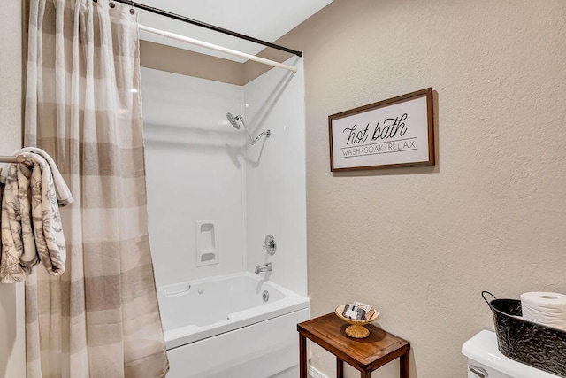 bathroom with toilet and shower / tub combo