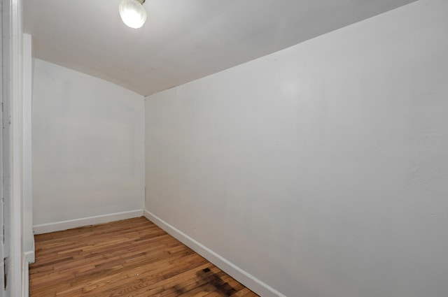 unfurnished room featuring hardwood / wood-style flooring