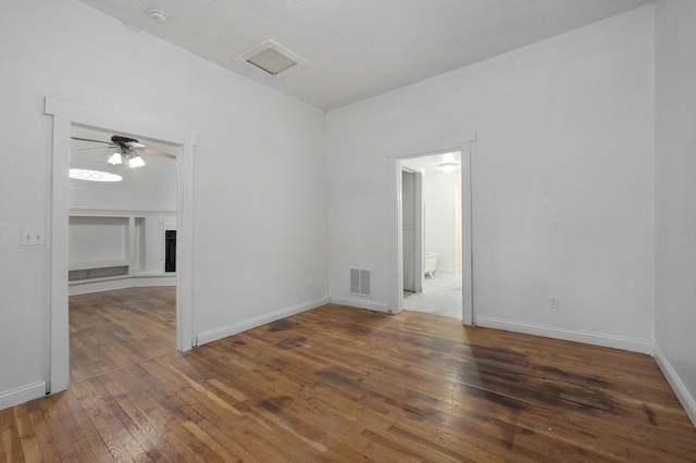 unfurnished room featuring ceiling fan and dark hardwood / wood-style floors