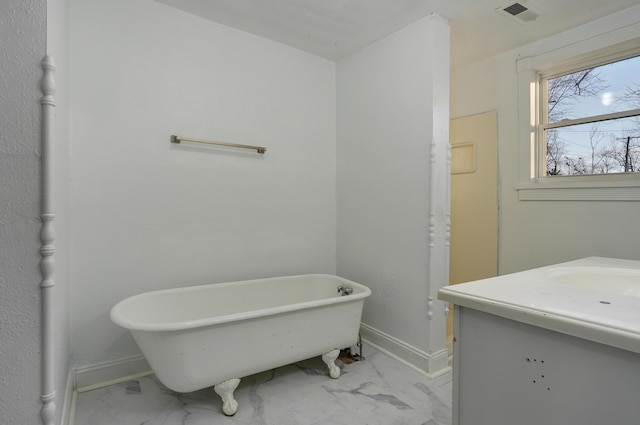 bathroom featuring a tub and vanity