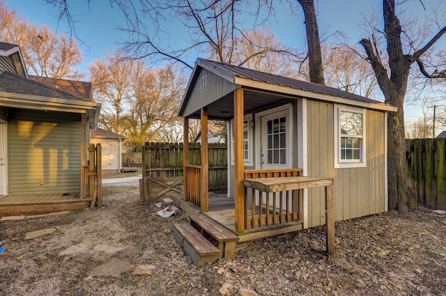 wooden deck featuring an outdoor structure