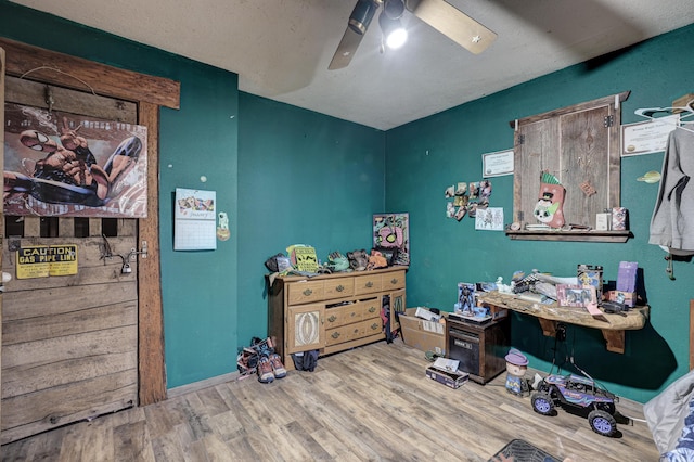 bedroom featuring ceiling fan and hardwood / wood-style floors