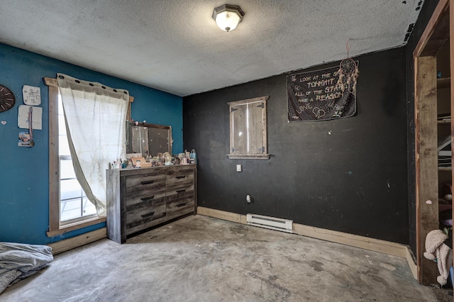 bedroom featuring concrete floors and a textured ceiling