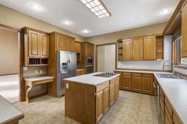 kitchen featuring light tile patterned flooring, sink, a textured ceiling, a kitchen island, and stainless steel appliances