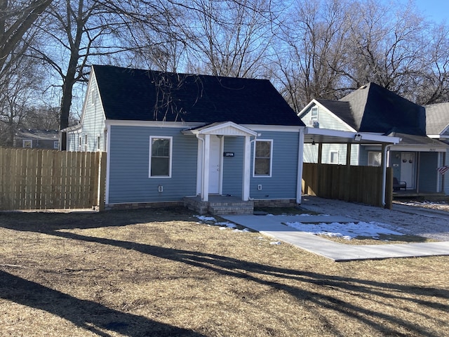 view of front of property featuring a carport