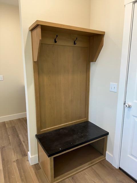 mudroom with light hardwood / wood-style flooring