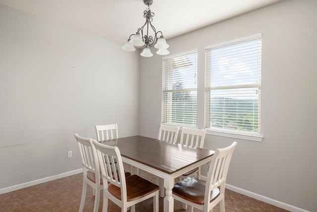 dining space with a chandelier