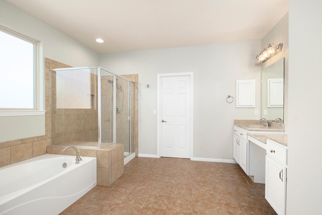 bathroom featuring vanity and shower with separate bathtub