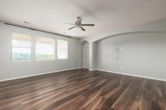 unfurnished room featuring ceiling fan and dark hardwood / wood-style flooring