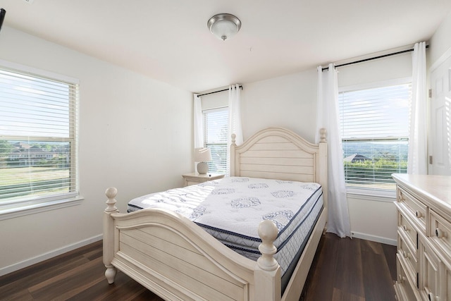 bedroom featuring dark wood-type flooring