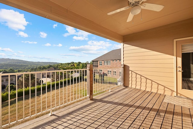 wooden deck with ceiling fan