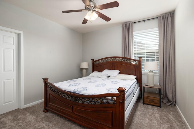 bedroom featuring ceiling fan and light carpet