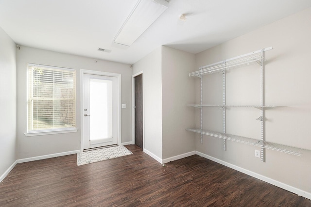 foyer entrance featuring dark hardwood / wood-style floors