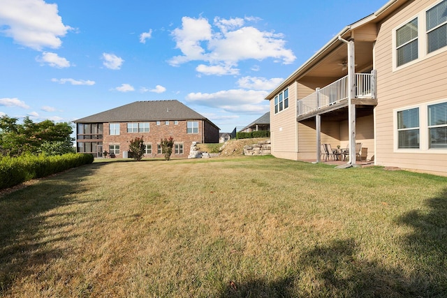 view of yard featuring ceiling fan and a patio