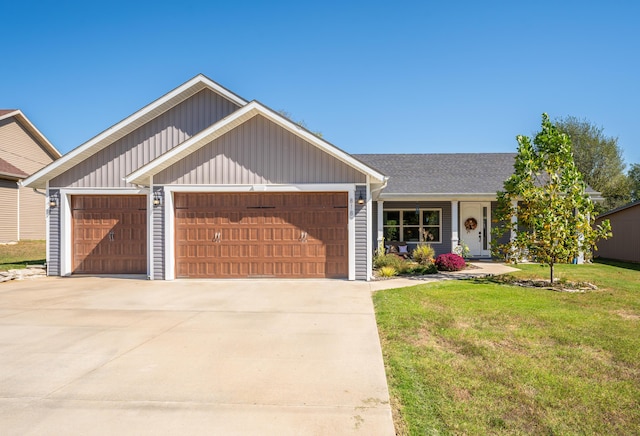 view of front of house with a garage and a front lawn