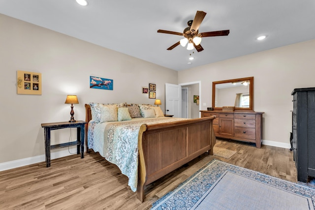 bedroom featuring ceiling fan and light hardwood / wood-style floors