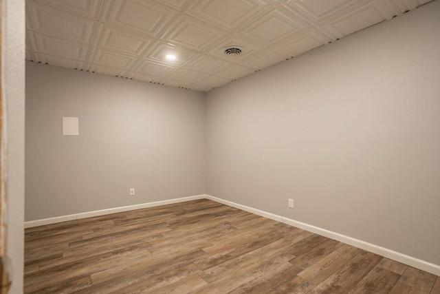 spare room featuring hardwood / wood-style floors