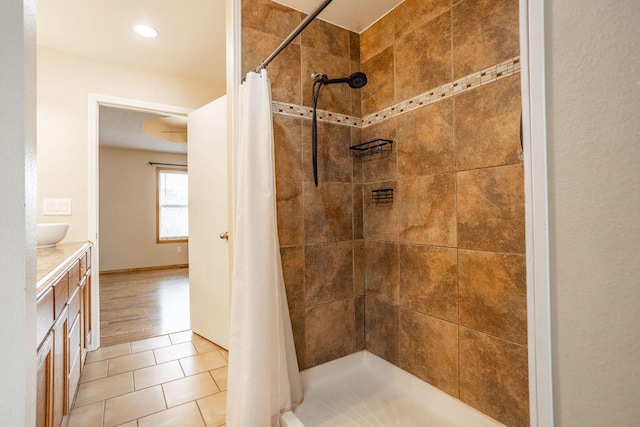 bathroom featuring tile patterned floors, curtained shower, and vanity