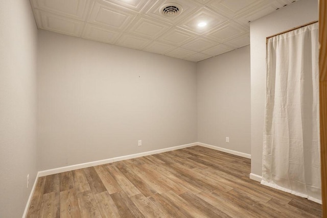 unfurnished room featuring hardwood / wood-style flooring