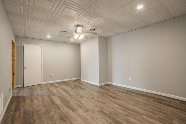 spare room with ceiling fan and light hardwood / wood-style floors