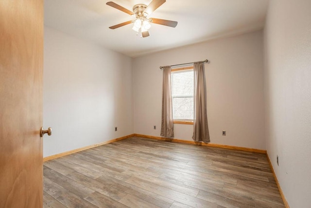 empty room featuring light hardwood / wood-style floors and ceiling fan