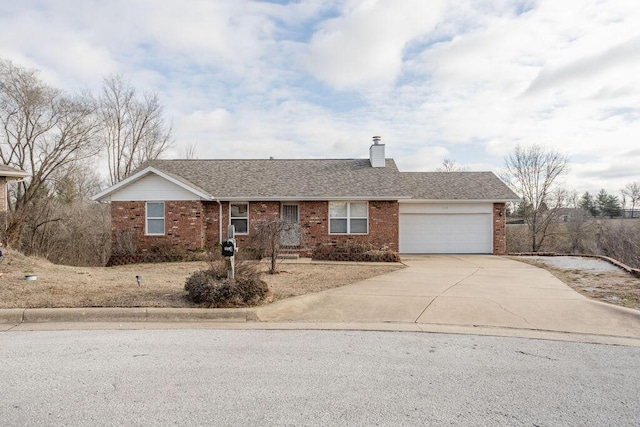 ranch-style house featuring a garage