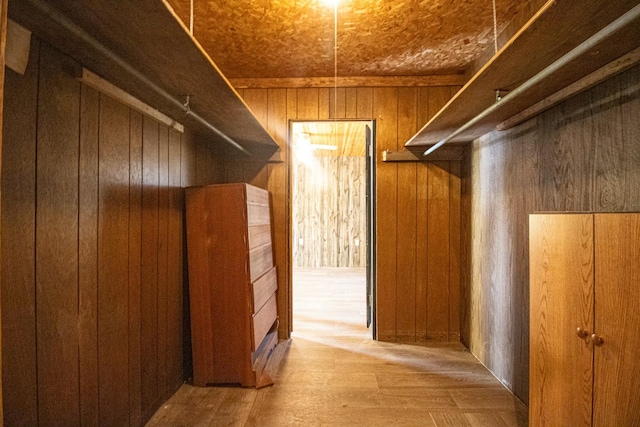 walk in closet with light wood-type flooring