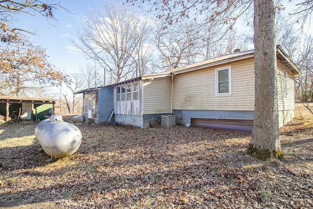 exterior space featuring central AC unit