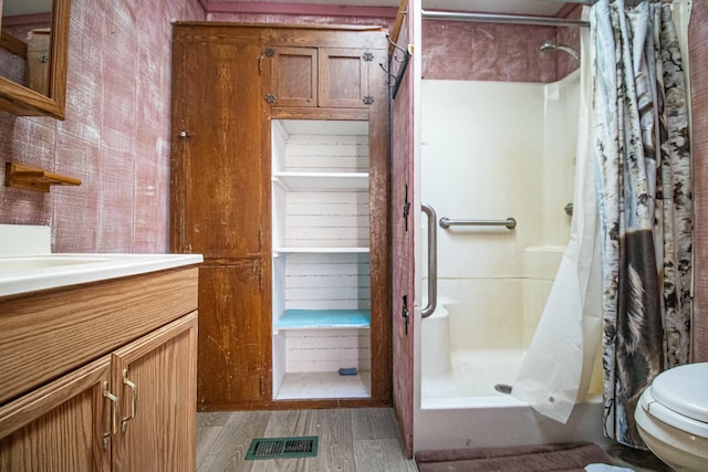 bathroom with toilet, vanity, and a shower with curtain