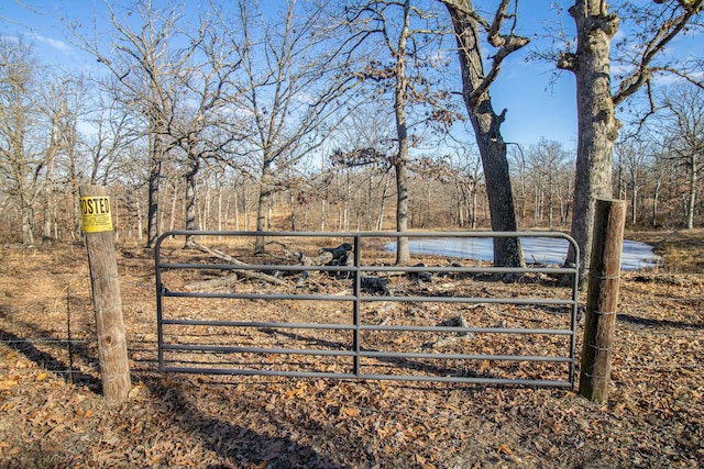 view of gate featuring a water view