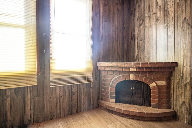 room details featuring hardwood / wood-style flooring and wood walls