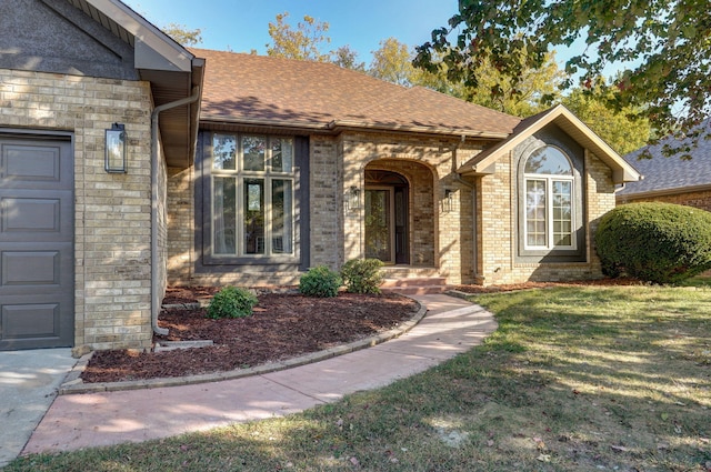 doorway to property with a yard