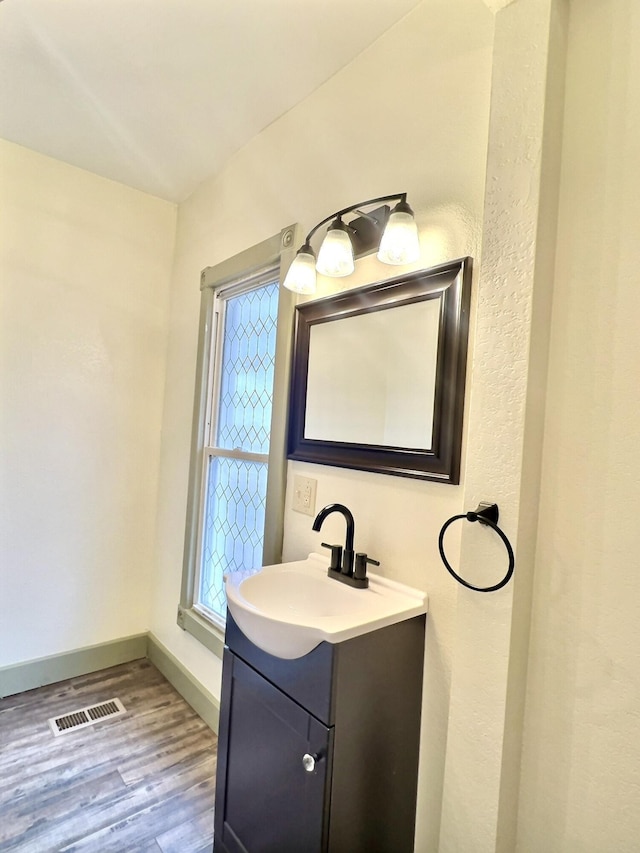 bathroom featuring vanity and wood-type flooring