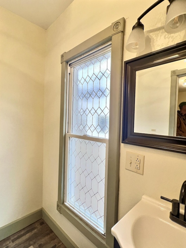 bathroom featuring vanity and hardwood / wood-style floors