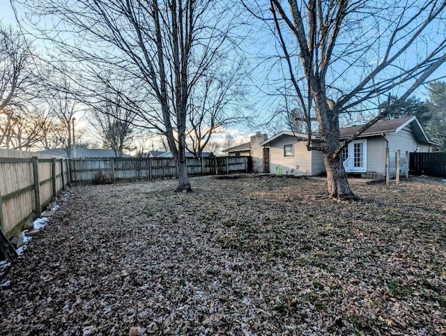 view of yard with a fenced backyard