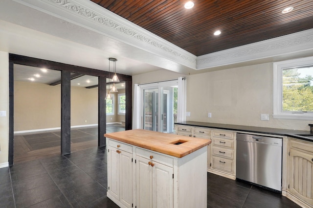 kitchen with butcher block counters, dishwasher, a kitchen island, dark tile patterned floors, and pendant lighting