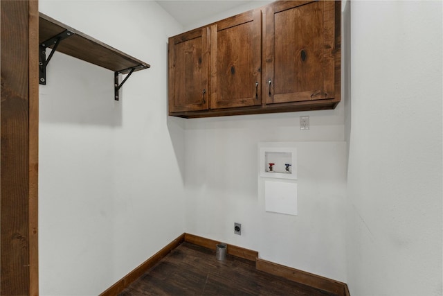 clothes washing area with hookup for a washing machine, cabinets, and hookup for an electric dryer