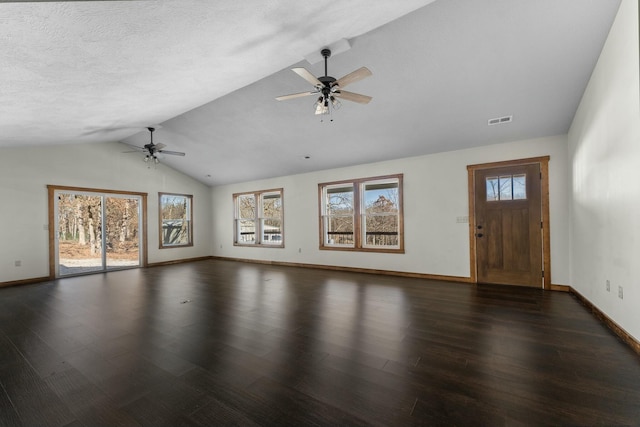 unfurnished living room with dark wood-type flooring, ceiling fan, and vaulted ceiling