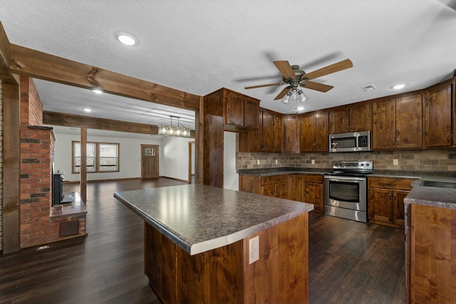 kitchen featuring beamed ceiling, backsplash, ceiling fan, stainless steel appliances, and dark wood-type flooring