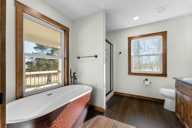 full bathroom with vanity, toilet, independent shower and bath, and wood-type flooring